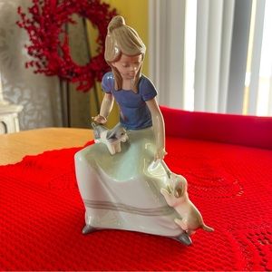 Lladro Perfect pristine condition. Lady sitting with two puppy dogs. Rare. Offer